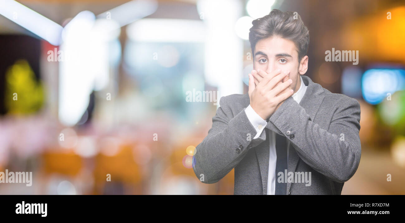 Shocked man covering mouth suit hi-res stock photography and images - Alamy