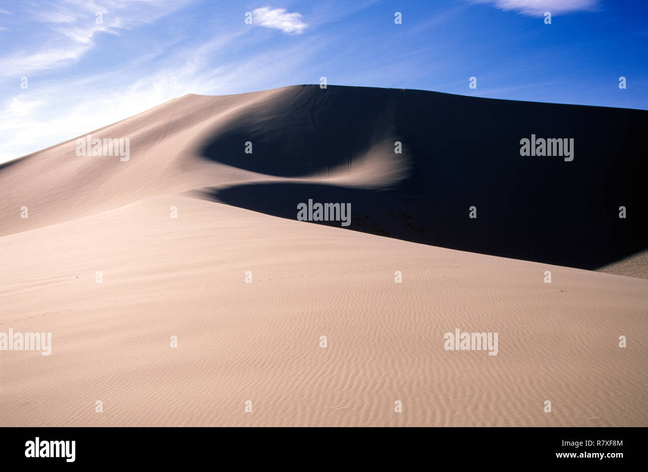 Sand dunes under a blue sky with clouds hi-res stock photography and ...