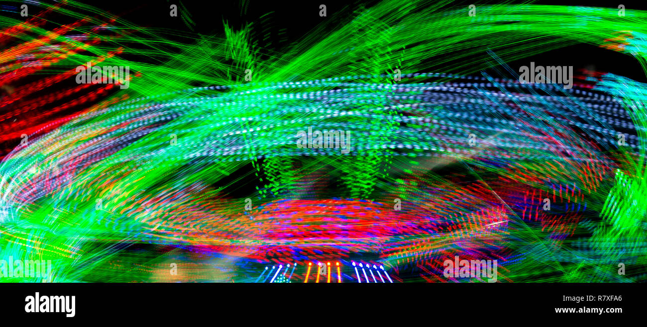 Long Exposure Of A Spinning Carnival Ride Stock Photo - Alamy
