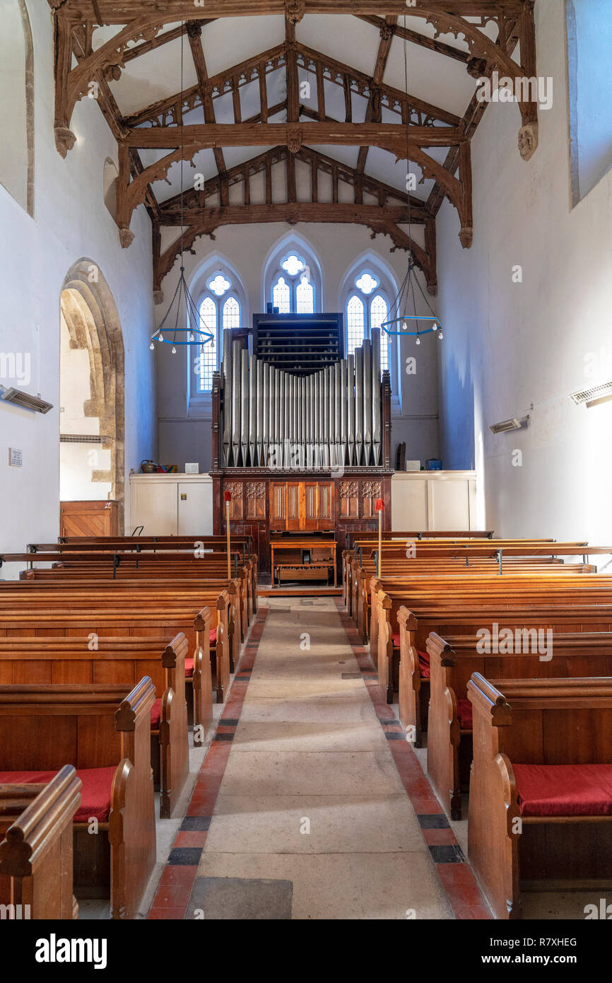 Amesbury church organ with pews in foreground Stock Photo