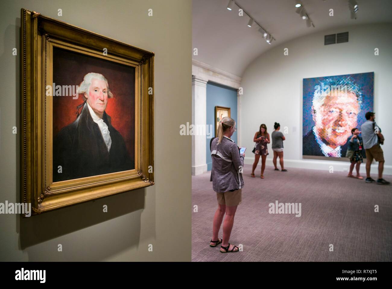 United States, District of Columbia, Washington, Reynolds Center for American Art, National Portrait Gallery, portraits of Presidents George Washington by Gilbert Stuart and Bill Clinton by Chuck Close Stock Photo