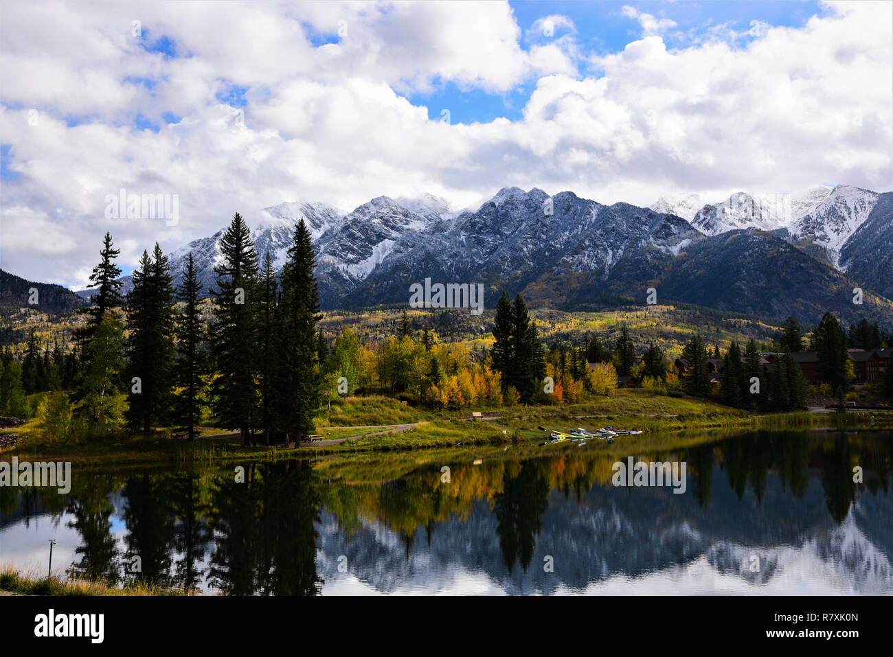 Mountain reflection of Autumn colors in a small lake Stock Photo - Alamy