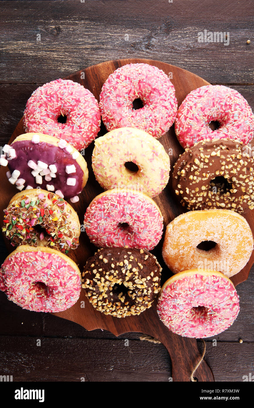 assorted donuts with chocolate frosted, pink glazed and sprinkles ...
