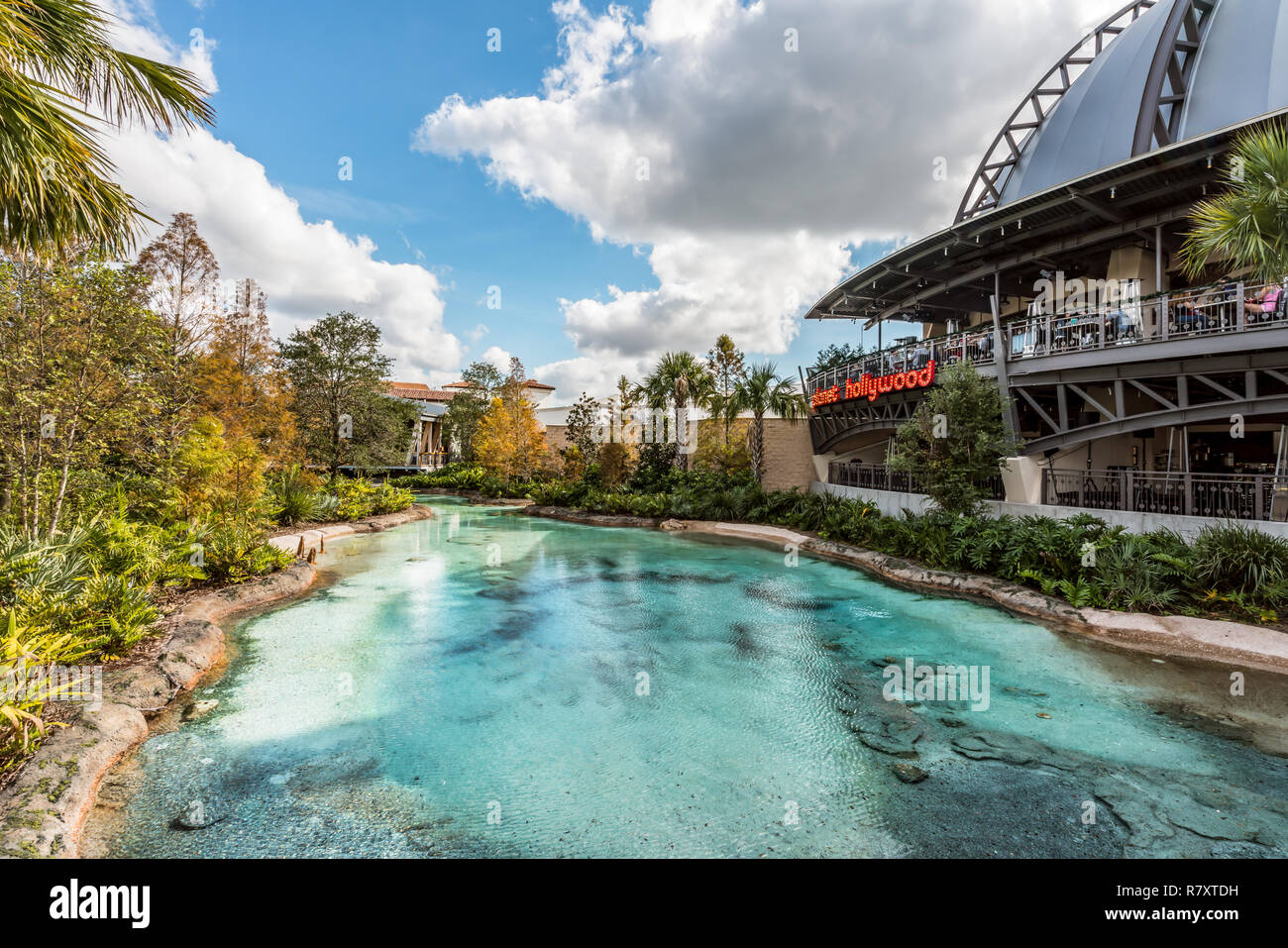 Orlando, Florida - December, 2017 - Planet Hollywood restaurant and artificial turquoise water lake Orlando, Florida - December, 2017 - Colorful artif Stock Photo