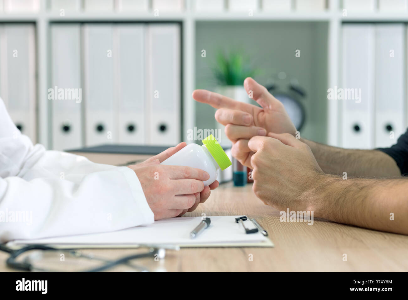 Doctor and patient discuss dietary supplement therapy in medical office