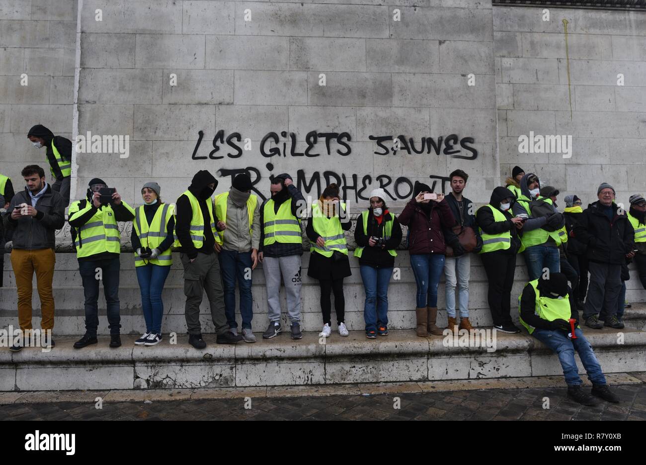 December 01, 2018 - Paris, France: Yellow vest protesters gather near the  Arc of Triumph at the westernmost part of the Champs-Elysees avenue. They  clashed with police after authorities set up a
