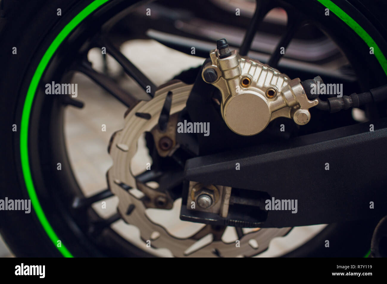 Disc brake of eco motorcycle, , scooter motorcycle background Stock