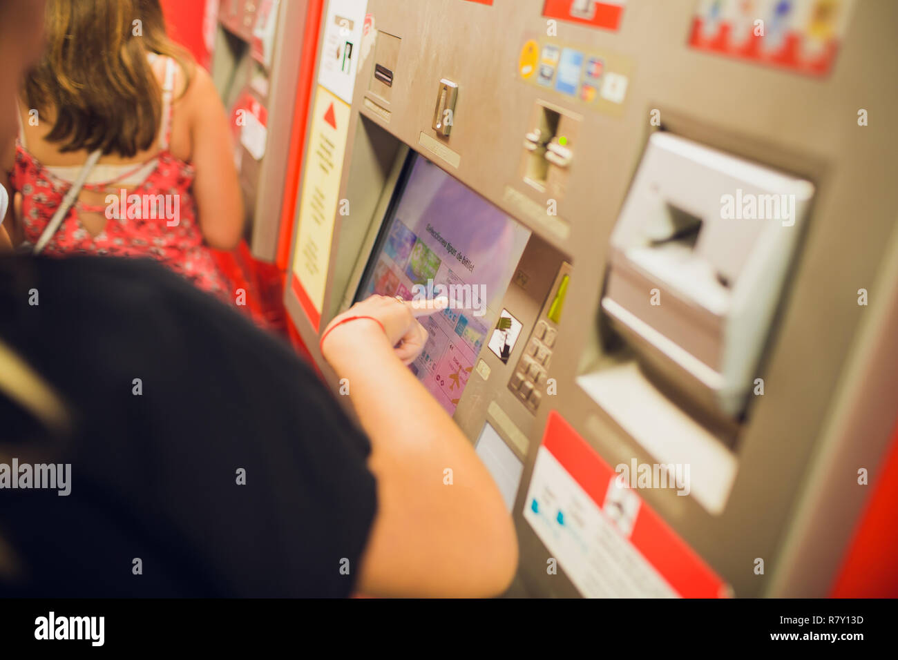 Woman Buying Train Ticket Using Vending Machine At Station Stock Photo ...
