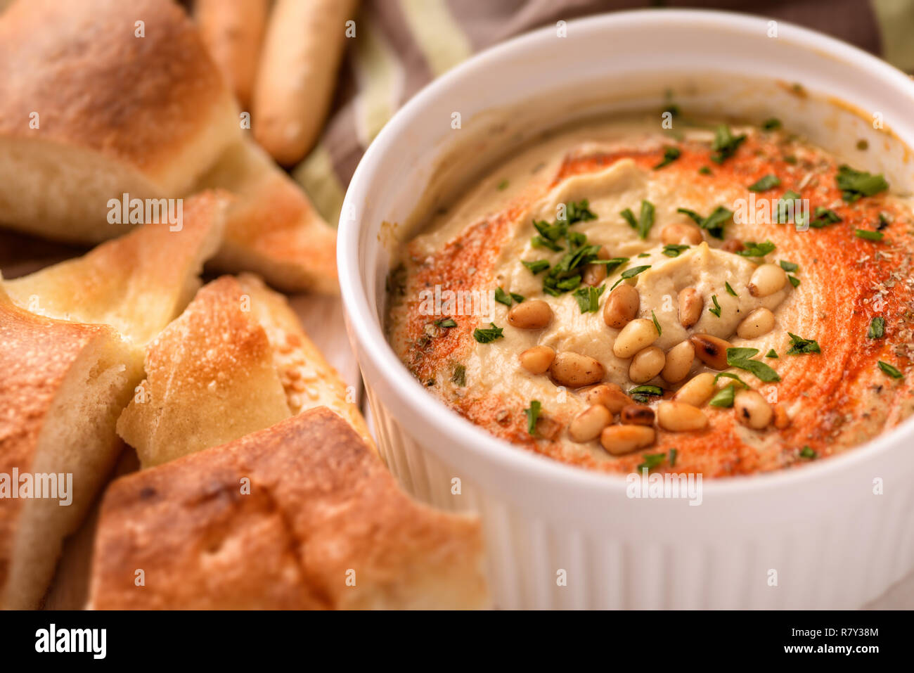 Close up of hummus with pine nuts Stock Photo