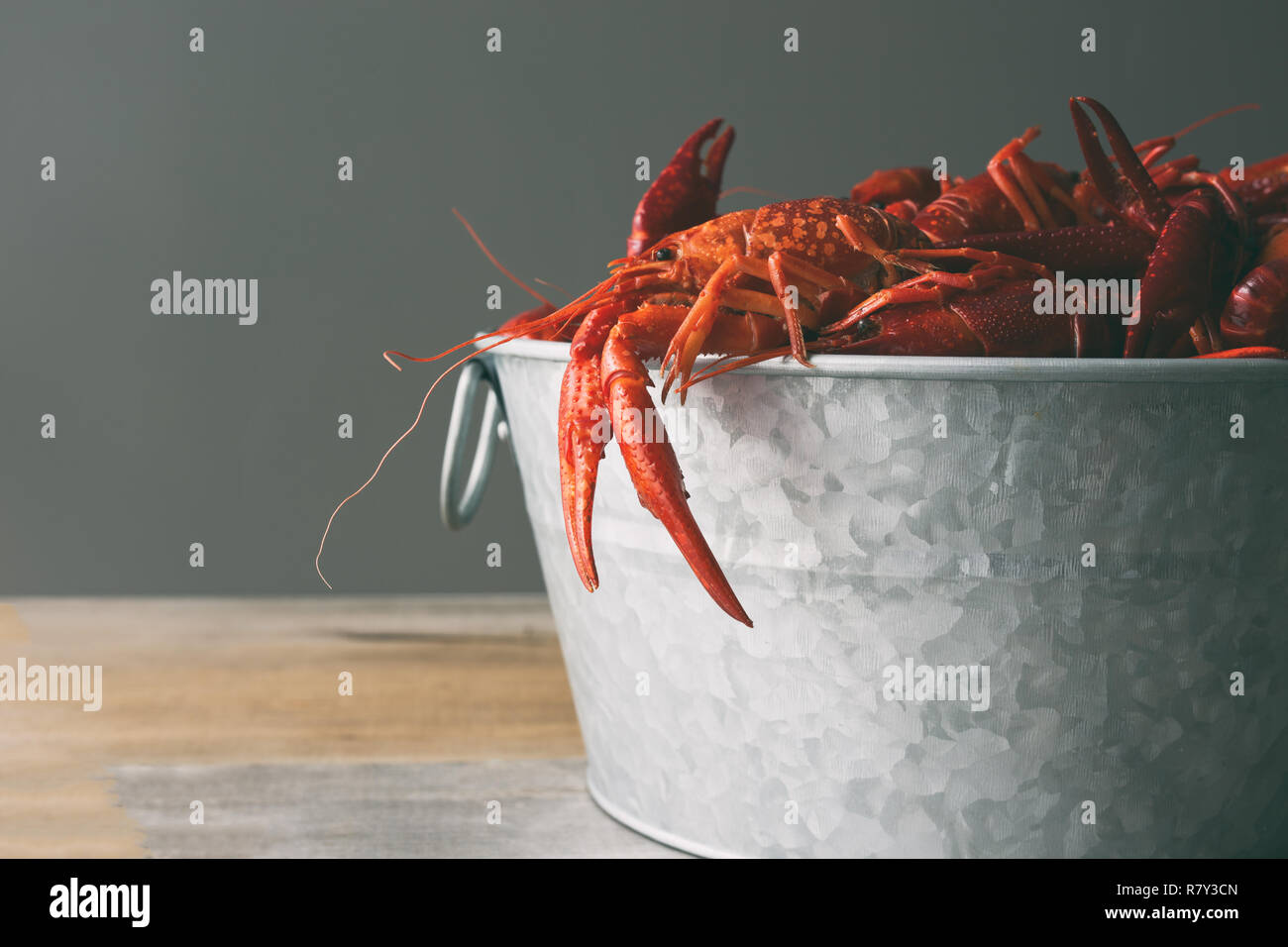 Steel bucket filled with boiled crayfish. Stock Photo