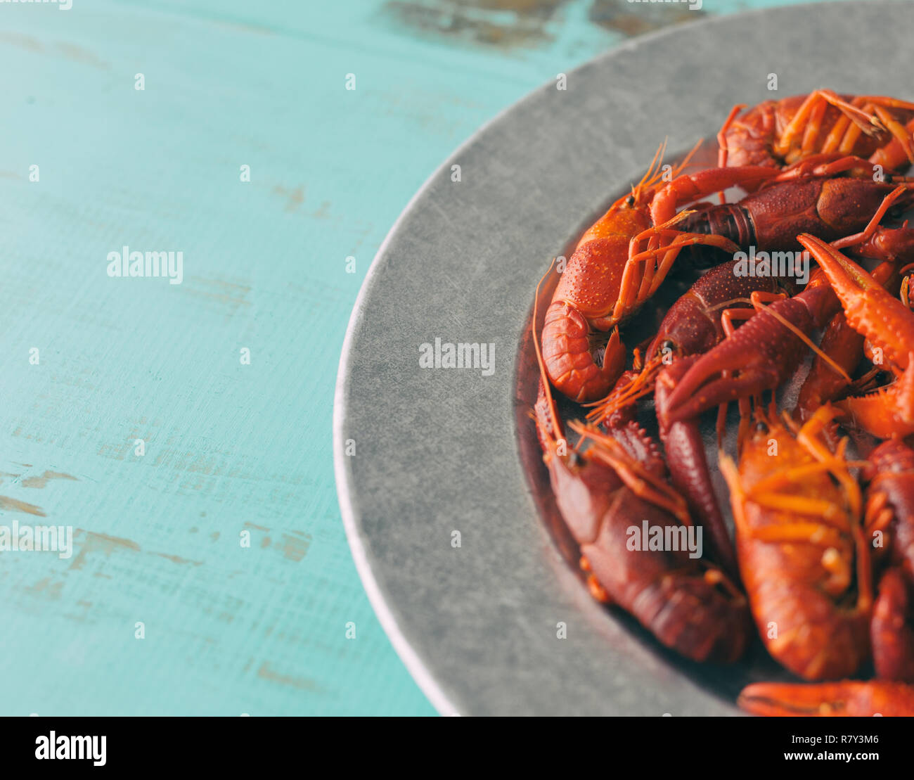 Several boiled crawfish on a galvanized steel plate. Stock Photo
