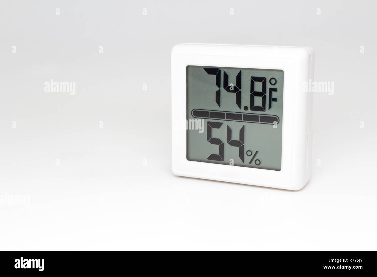 Digital device measuring temperature and humidity. Thermometer and