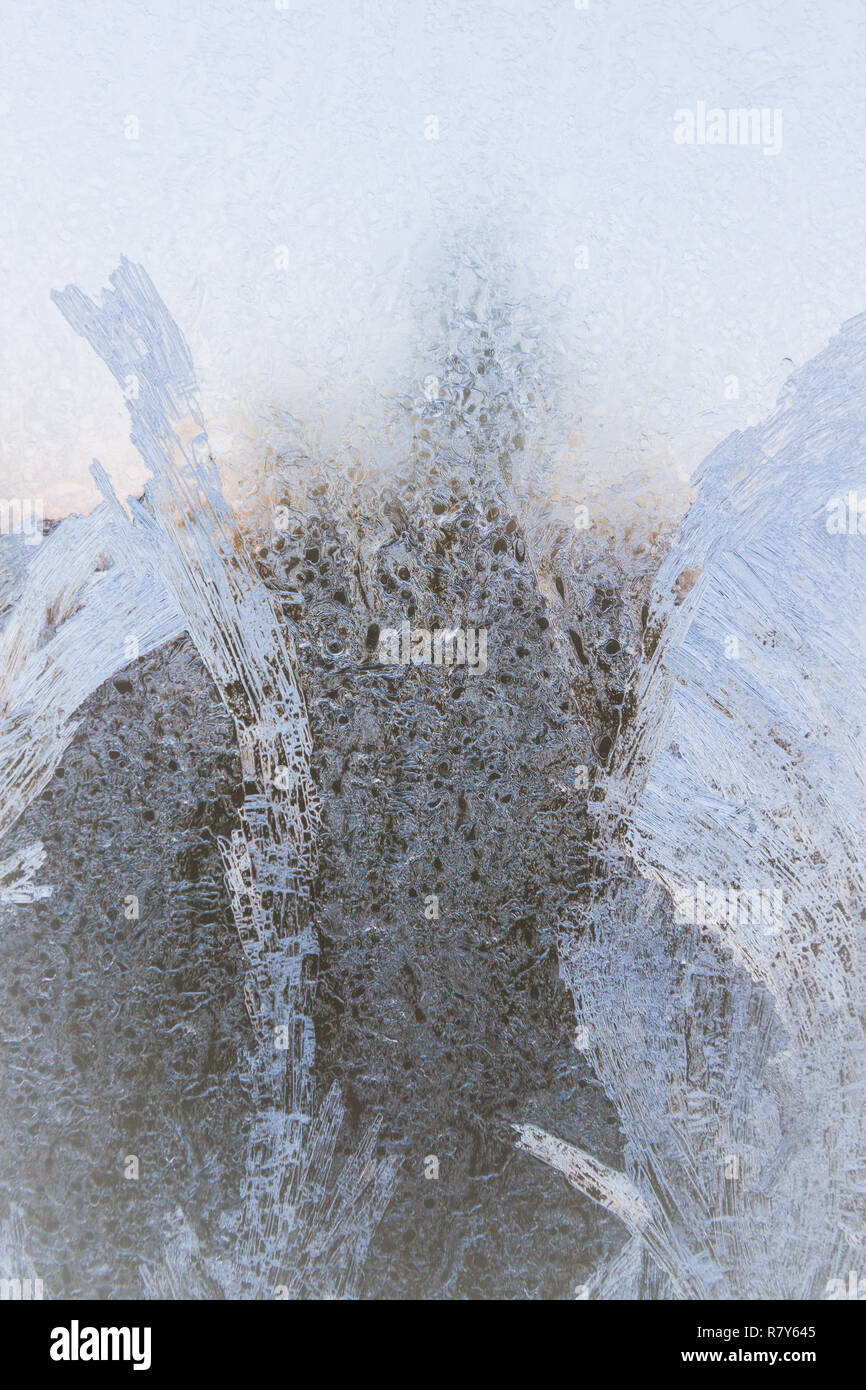 Painted developed frosty patterns on the winter ice window Stock Photo ...