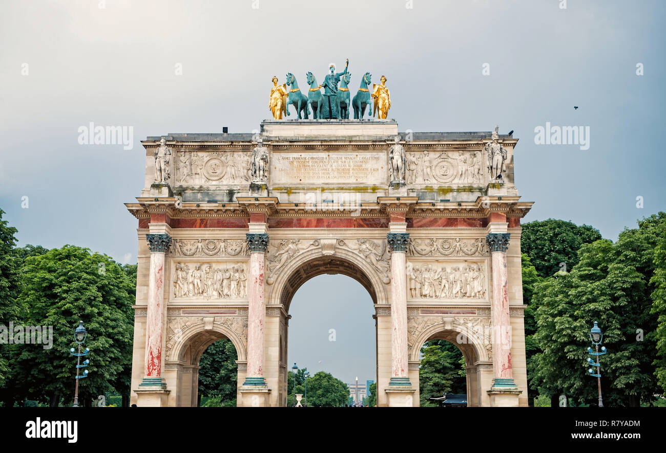 Triumphal Arch Arc de Triomphe du Carrousel at Tuileries gardens in Paris, France. Monument was built between 1806-1808 to commemorate Napoleon's military victories. Stock Photo