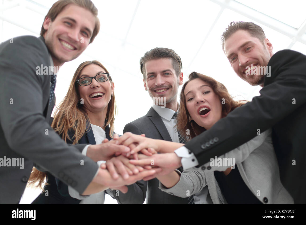 happy business team celebrating victory in office Stock Photo - Alamy