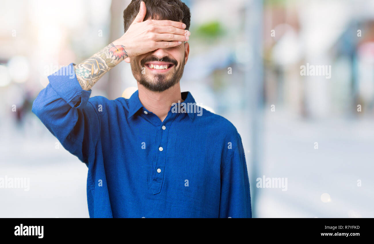Young handsome man over isolated background smiling and laughing with ...