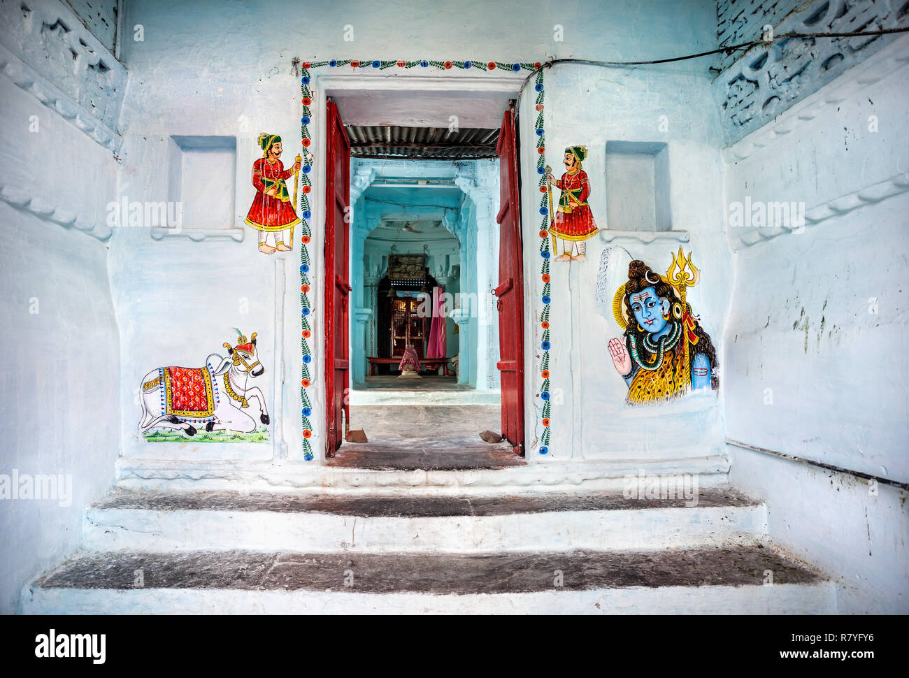 Traditional Rajasthan paintings on the Hindu temple wall in Udaipur, Rajasthan, India Stock Photo