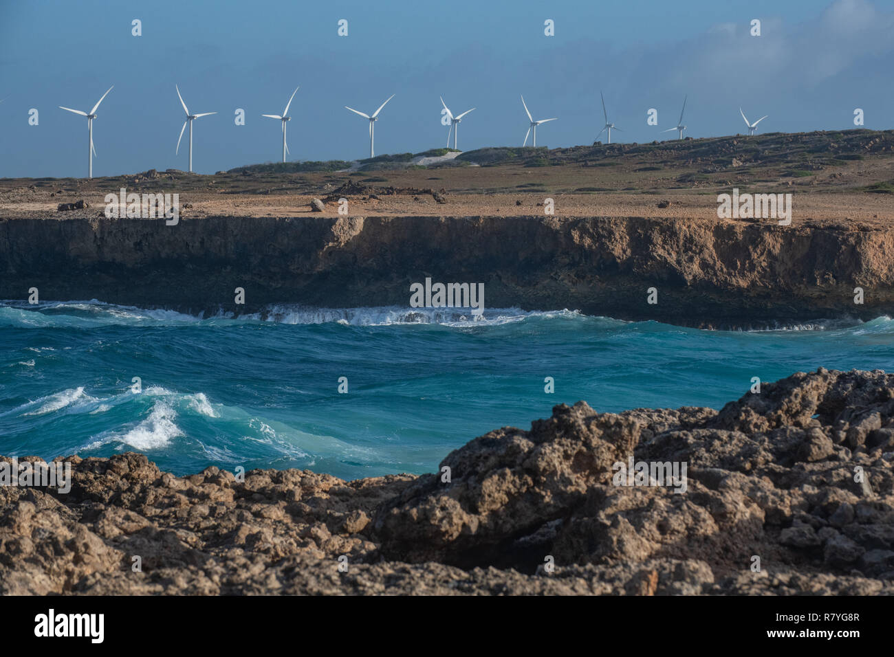 Sustainability Windmill farm Aruba in Arikok National Park - effort from wind power - wind turbines form a wind farm to increase renewable energy Stock Photo