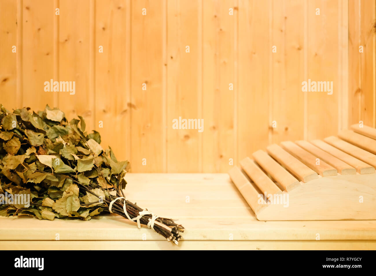 Russian or finnish sauna broom and headrest in wooden sauna. Steam bath