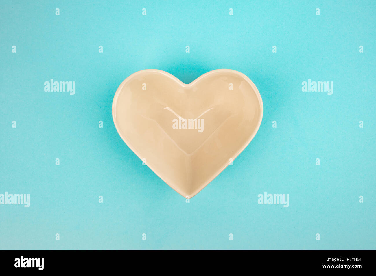 Heart Bowl isolated on light blue background Stock Photo