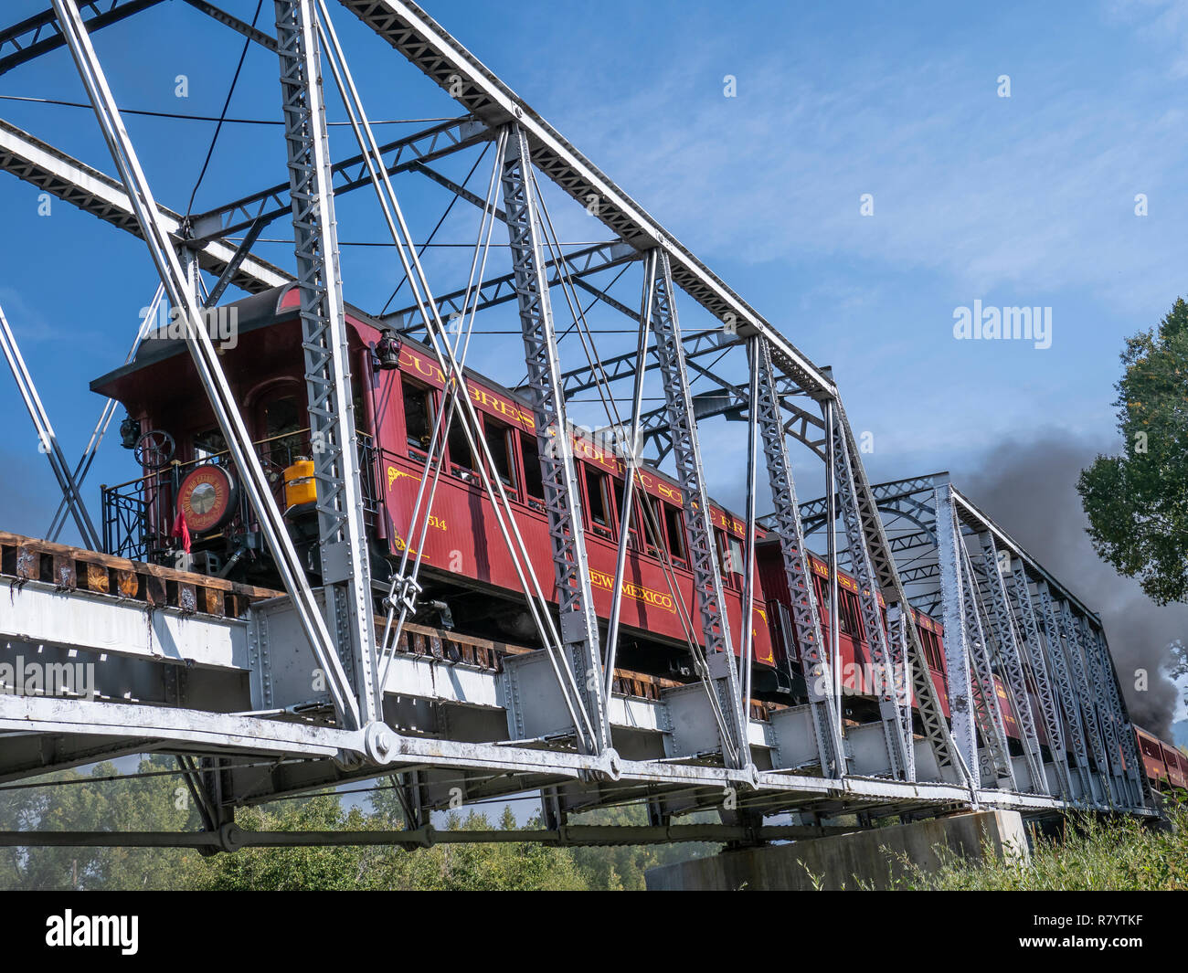 Cumbres & Toltec Scenic Railroad train crosses the Chama River behind the Rio Chama RV Park, Chama, New Mexico. Stock Photo