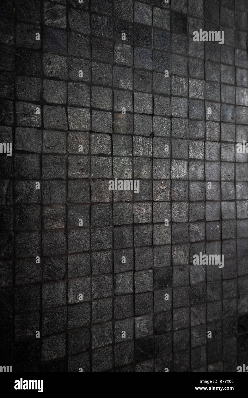 Dark Grey Mosaic Tiles pattern on the wall. Stock Photo