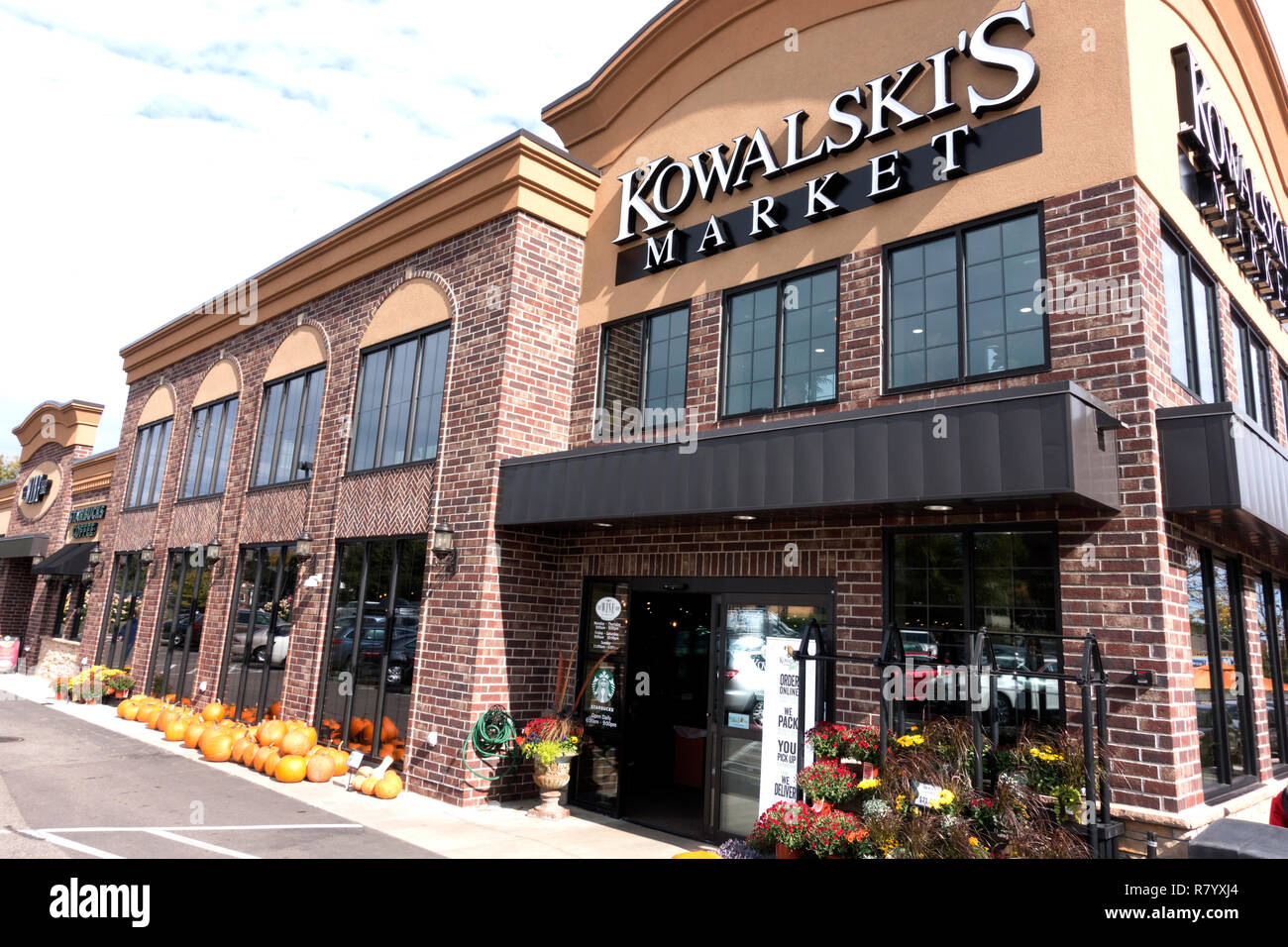 The remodeled Kowalski's Market grocery on Grand Avenue with autumn flowers and pumpkins in front for sale. St Paul Minnesota MN USA Stock Photo