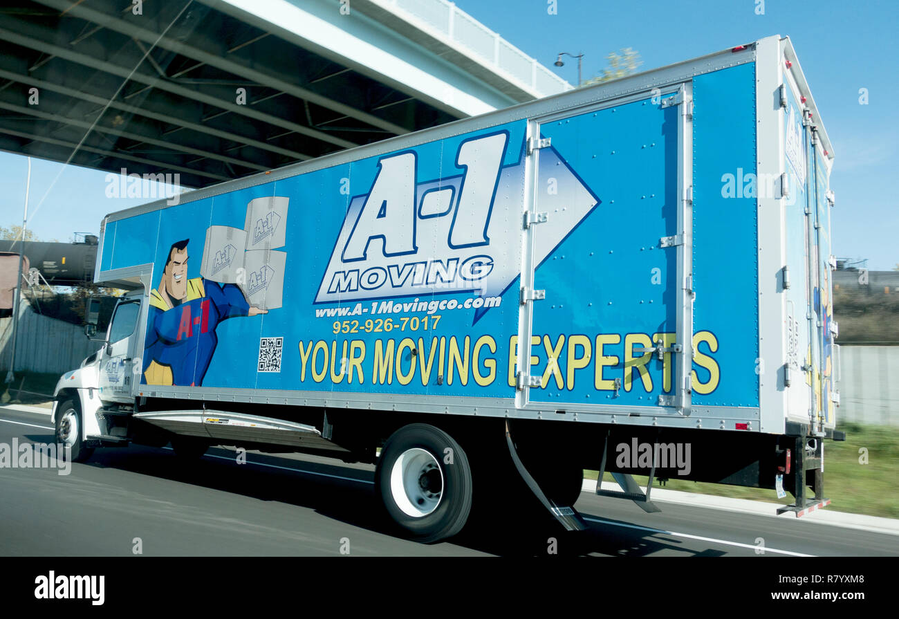 Moving van with an A-1 Superhero advertising moving experts. Freeway 94 Minnesota MN USA Stock Photo