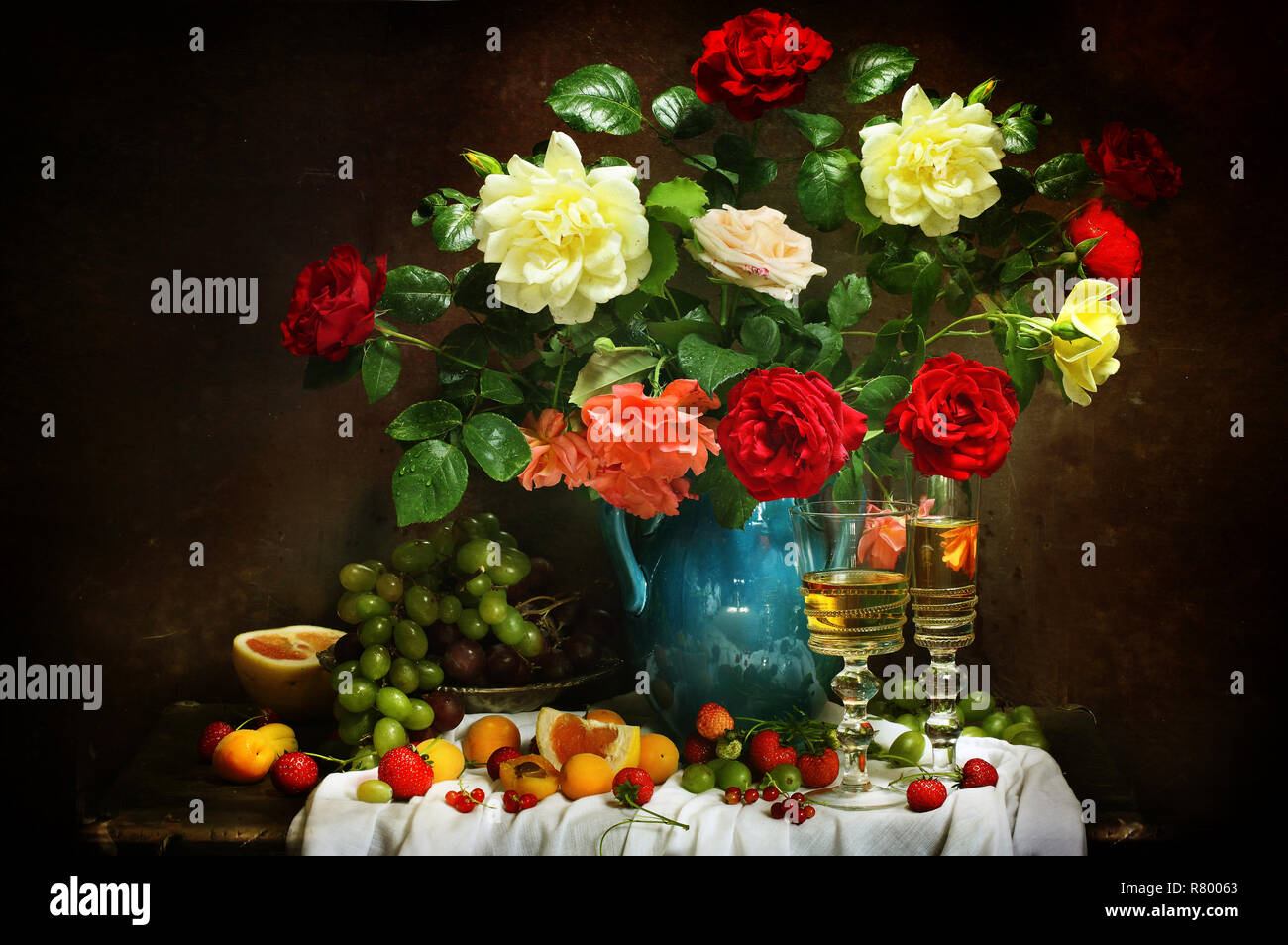 Still life with a bouquet of roses in a blue vase with wine and fruit ...