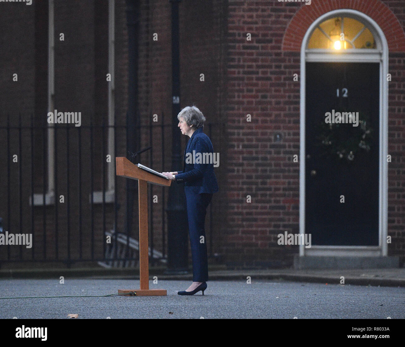 Prime Minister Theresa May making a statement outside 10 Downing Street, London, after the 1922 Committee announced that enough Conservative MPs have requested a vote of confidence in Mrs May to trigger a leadership contest. Stock Photo