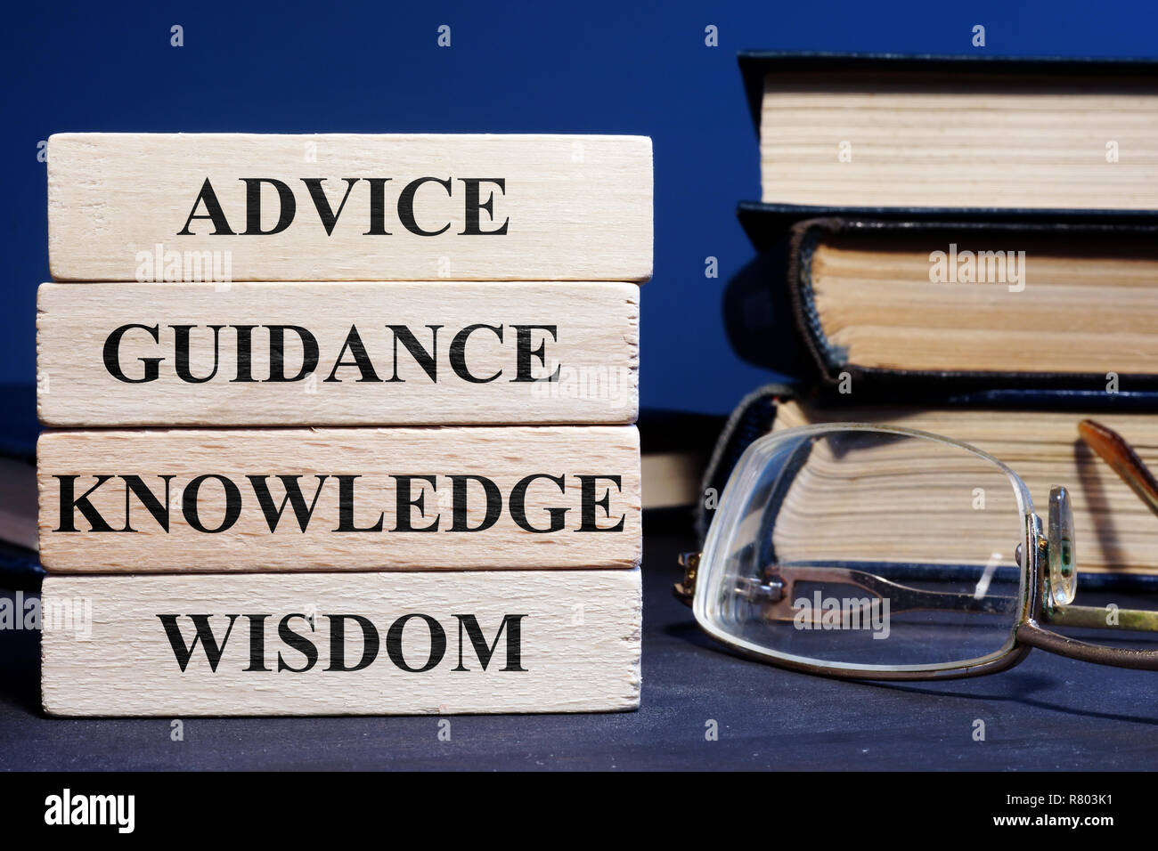 Wooden blocks with words Advice Guidance Wisdom Knowledge. Stock Photo
