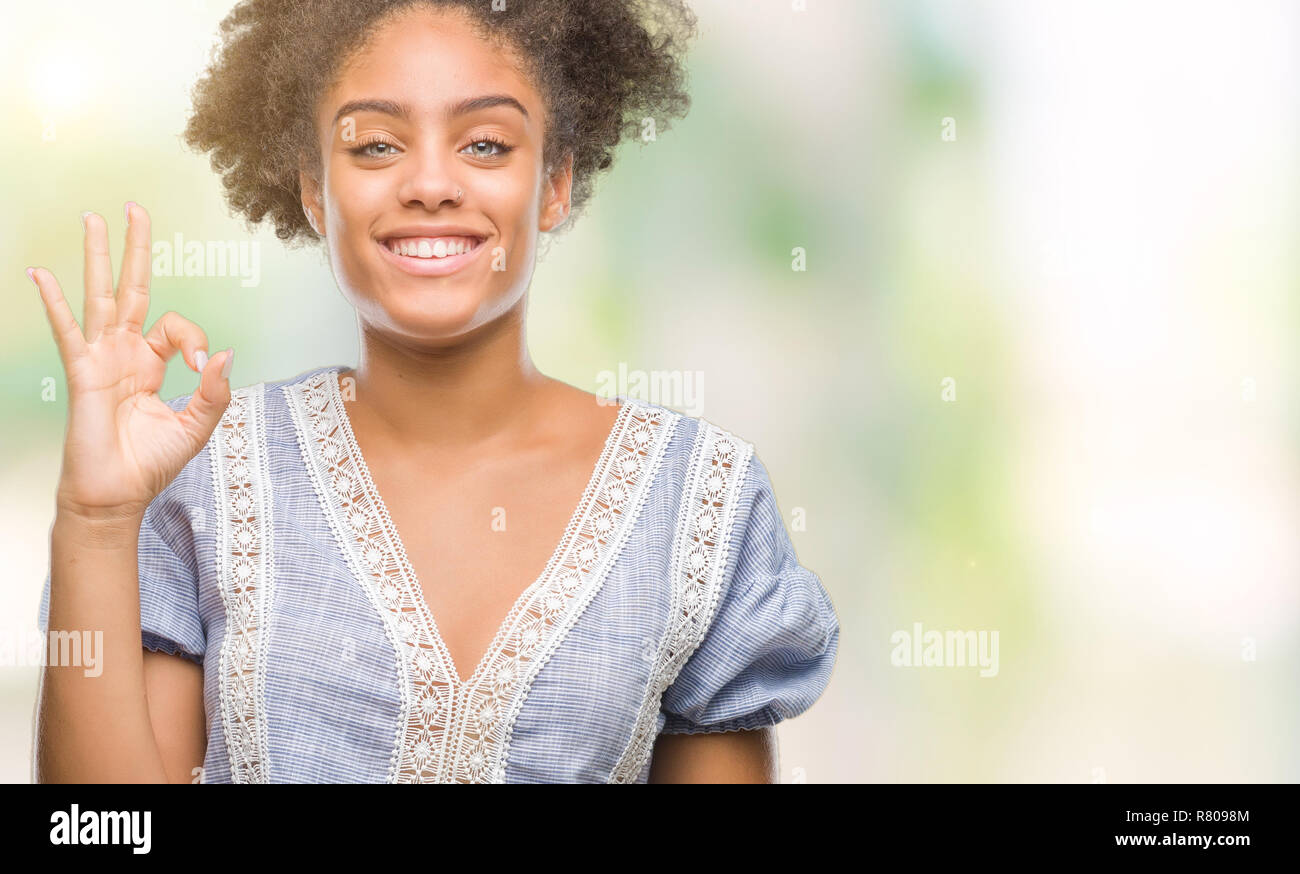 Young afro american woman over isolated background smiling positive ...