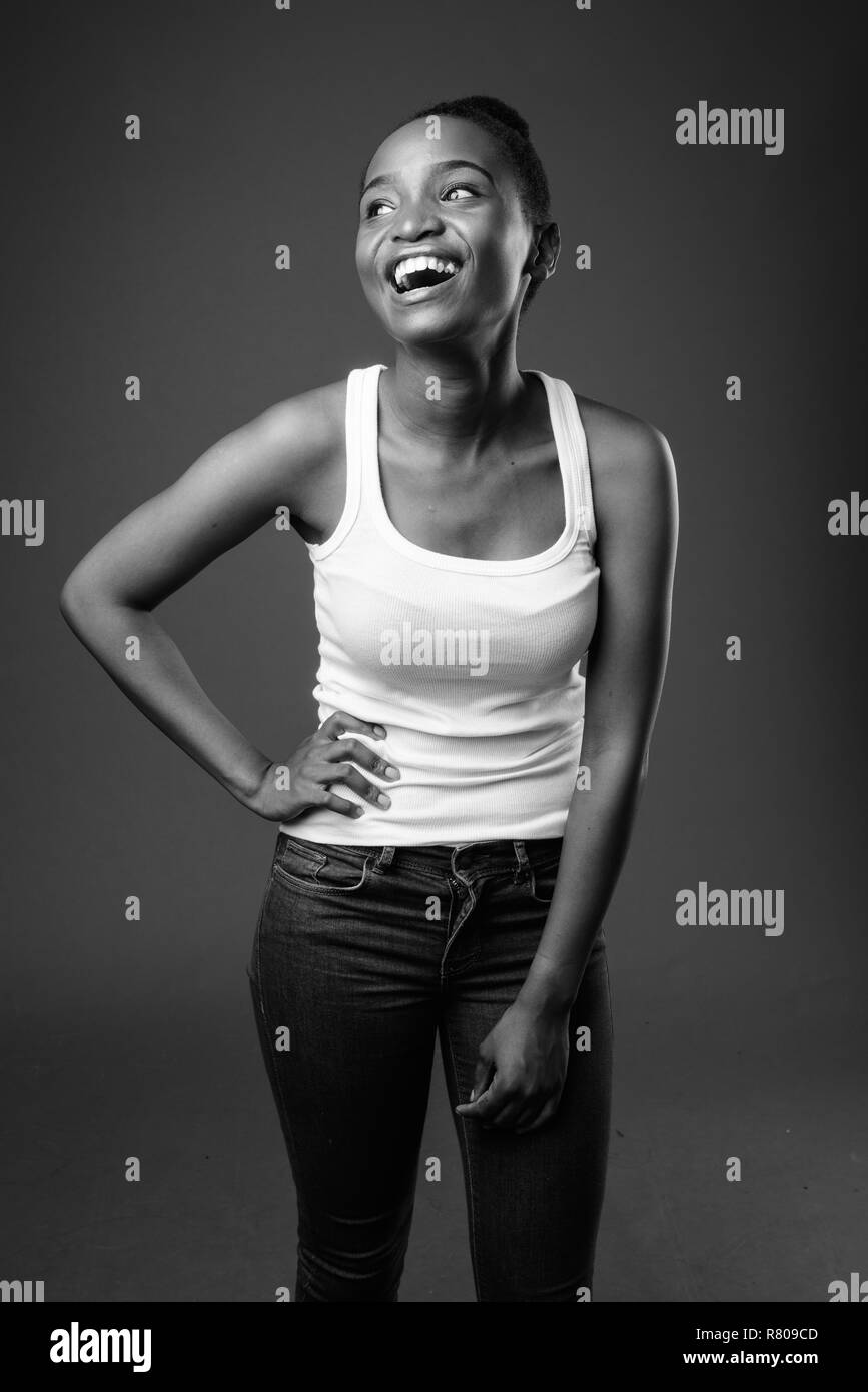 Young beautiful African Zulu woman laughing in black and white Stock Photo