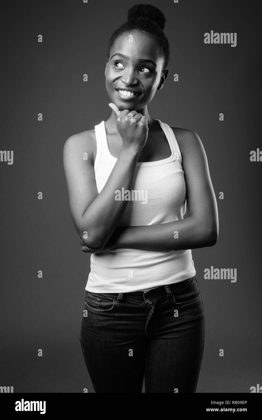 Happy African Zulu woman thinking in black and white Stock Photo