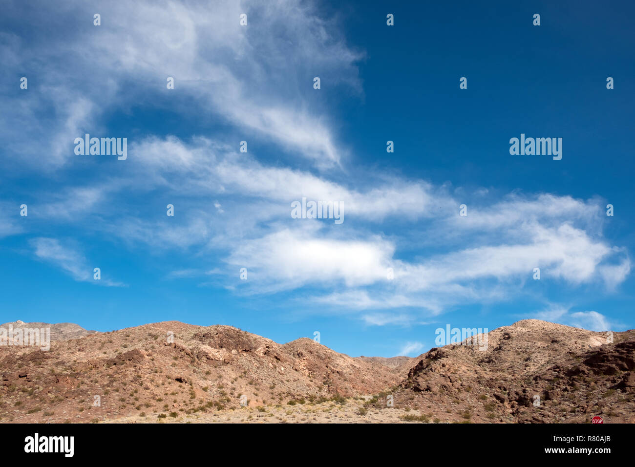 Scenic desert landscape against blue sky Stock Photo