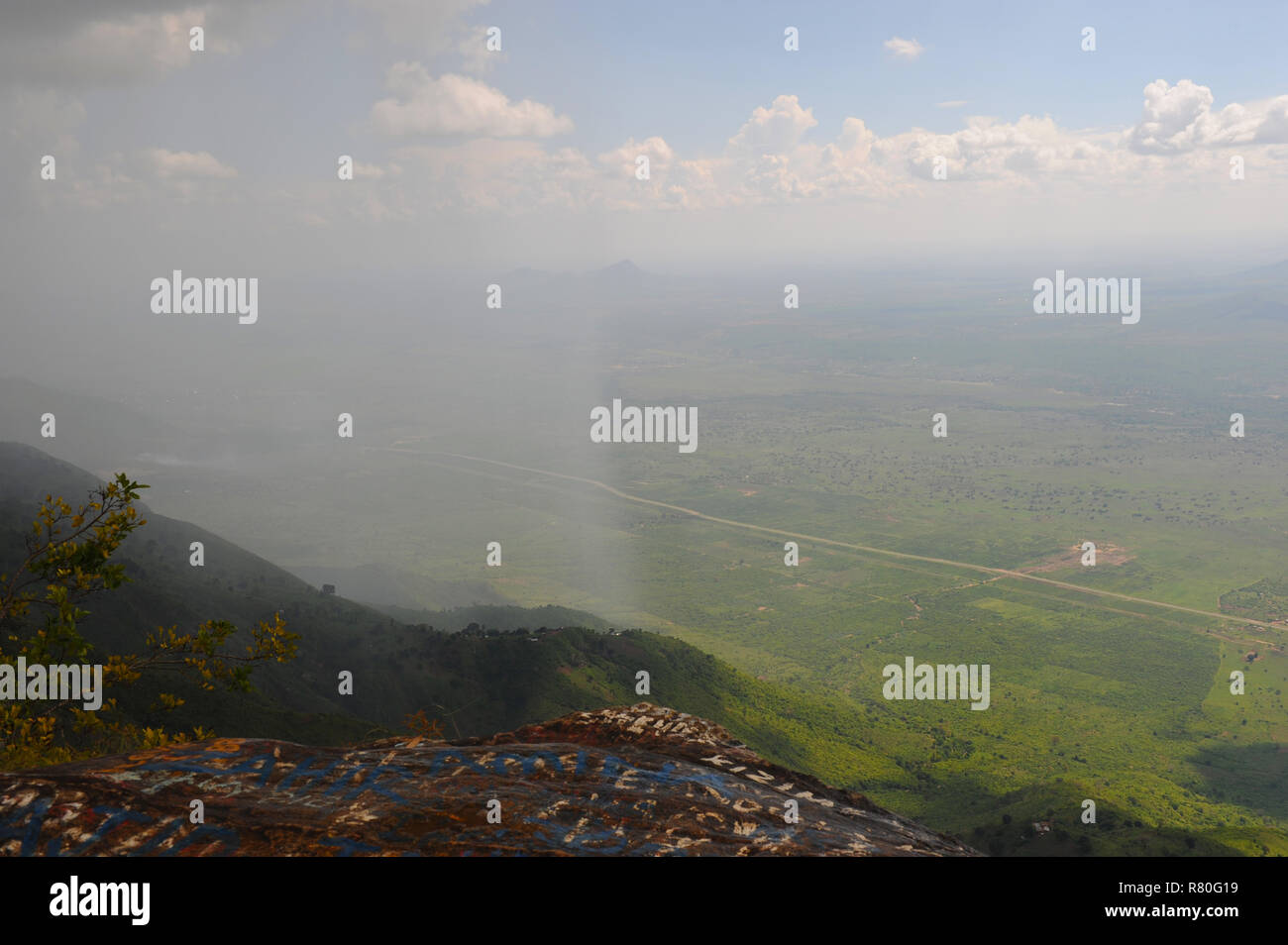 Breathtaking scene of Africa partly in rain taken from Usambara Mountain cliff Lushoto of Great North Road B1 through Mazinde-Mombo towns and Manyara. Stock Photo
