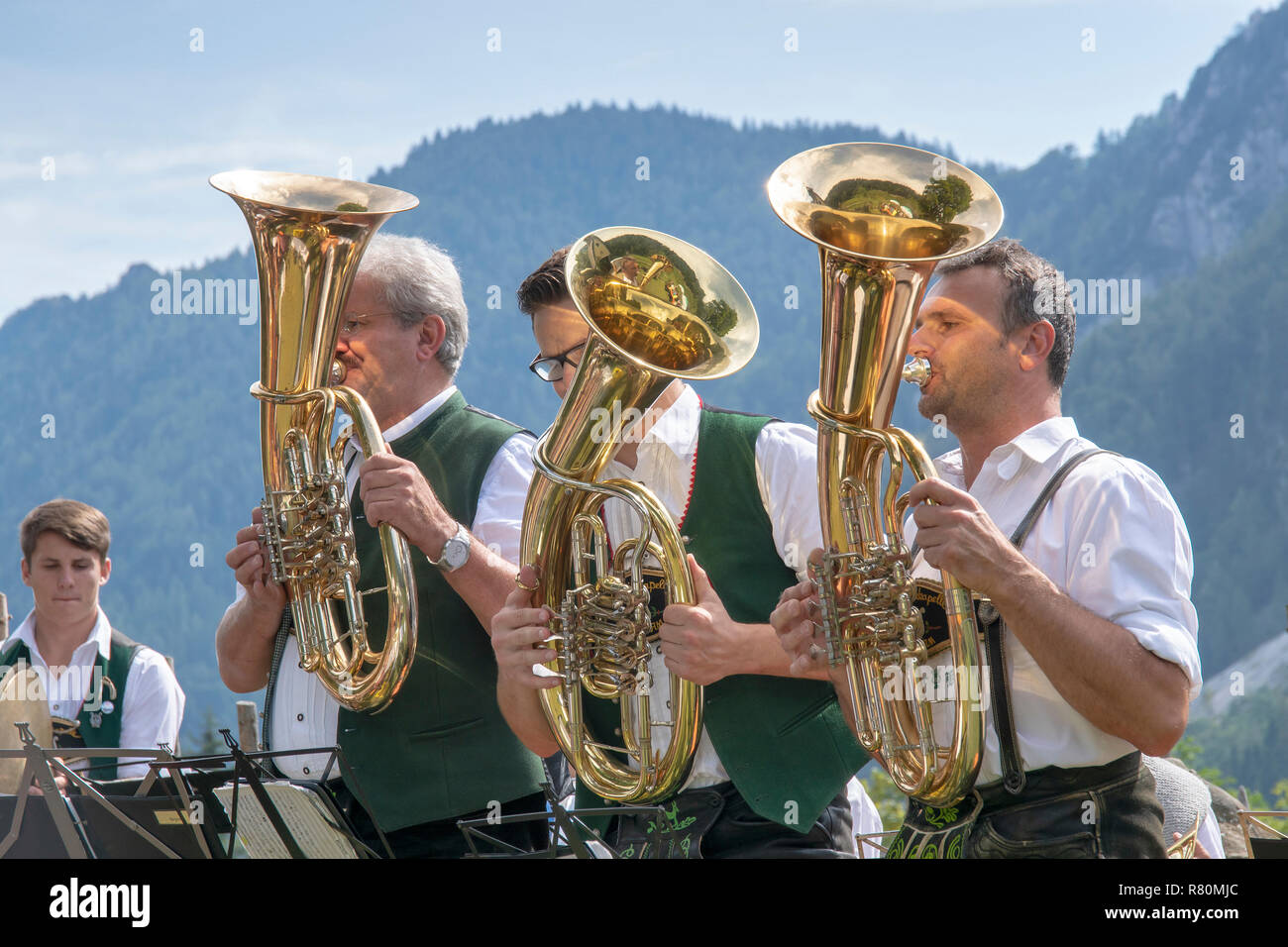 Traditional Bavarian brass band during a celebration on a mountain ...