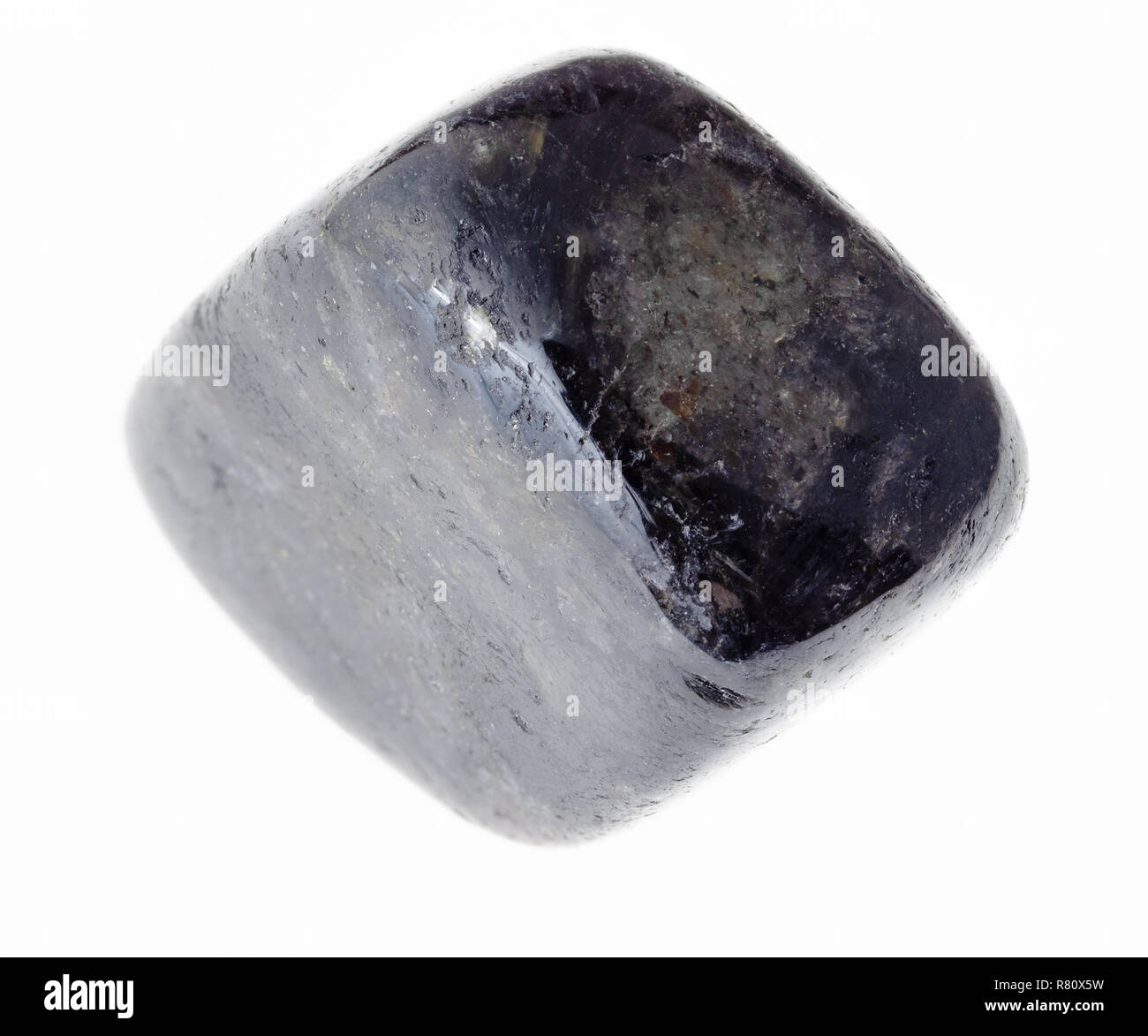 macro photography of natural mineral from geological collection - polished anthophyllite (antofillite) gem stone on white background Stock Photo