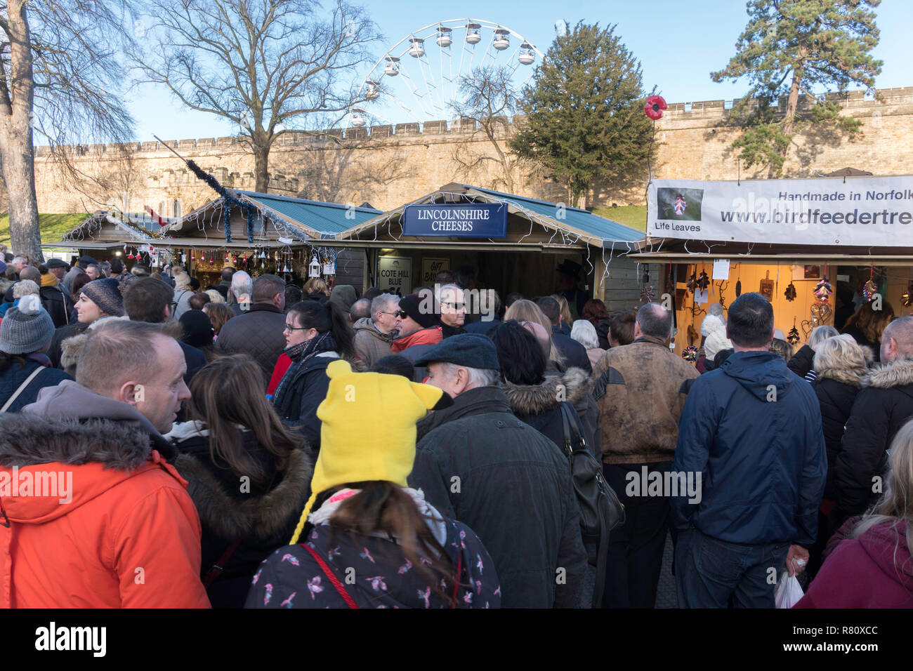 Crowd of people within LIncoln castle at Lincoln Christmas Market, Lincolnshire, England, UK Stock Photo