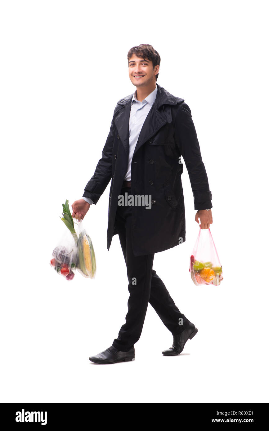 Young handsome man with vegatables in shopping concept Stock Photo