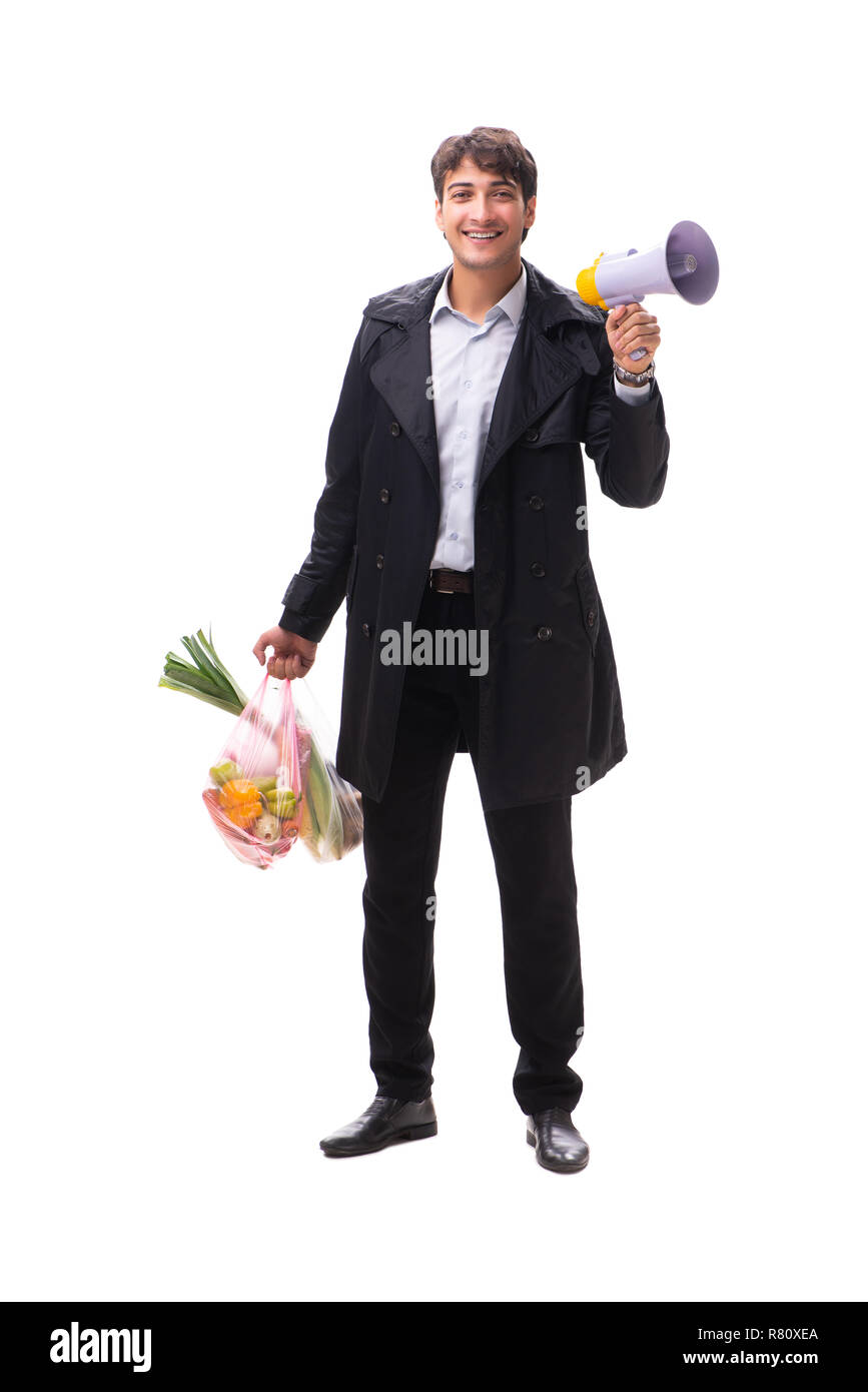 Young handsome man with vegatables in shopping concept Stock Photo