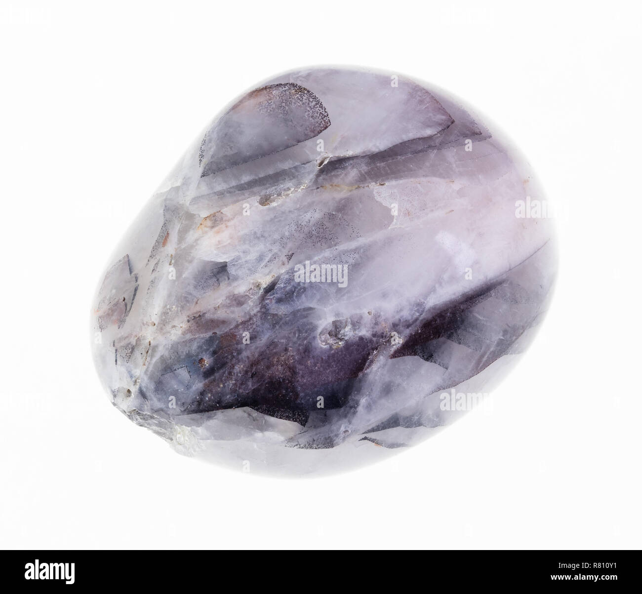 macro photography of natural mineral from geological collection - tumbled tamerlane stone (amethyst quartz) on white background Stock Photo