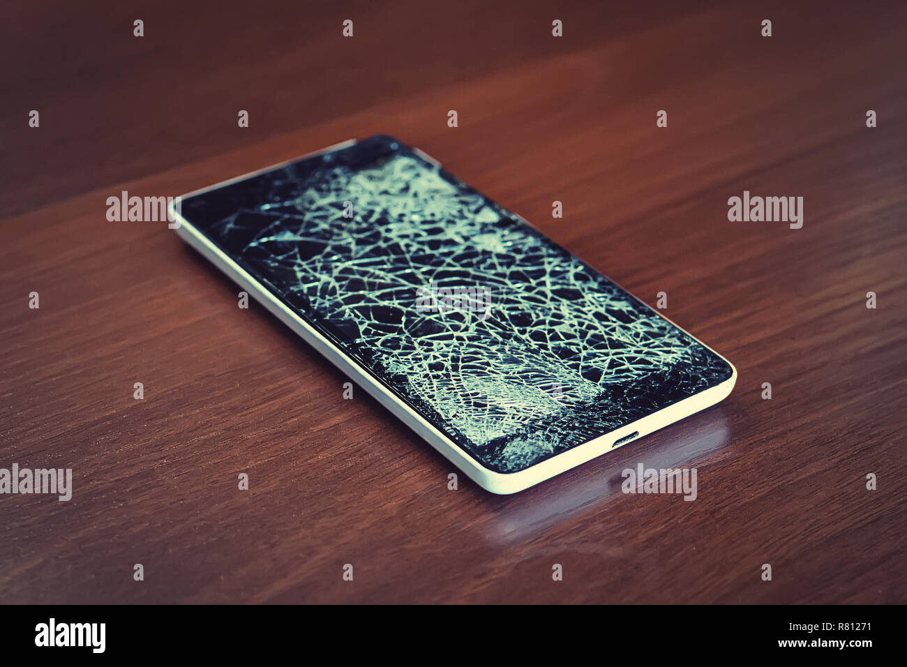 Black smartphone with broken screen Stock Photo