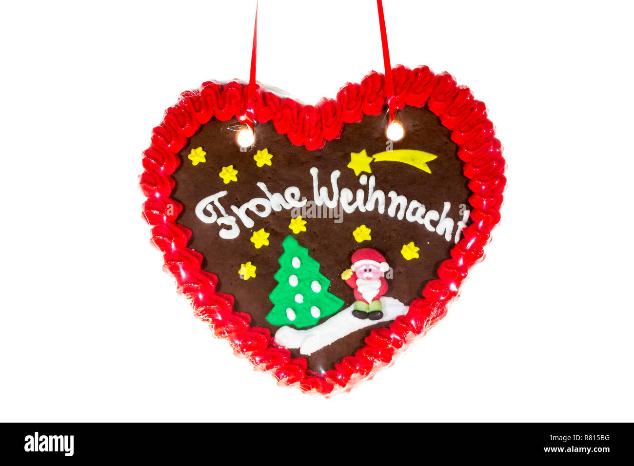 Gingerbread heart with the writing 'Frohe Weihnachten', German for 'Merry Christmas' Stock Photo