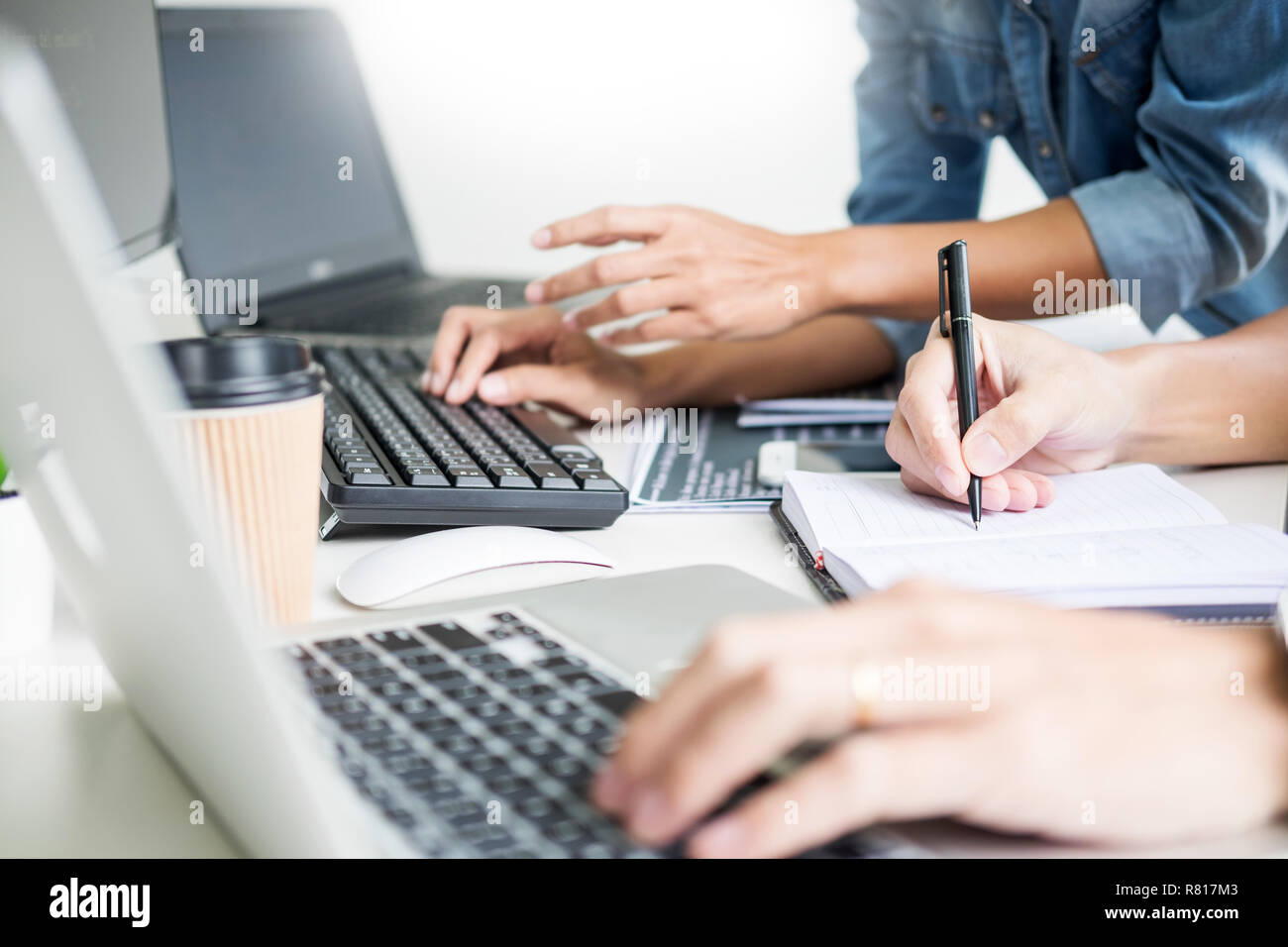 Asian team Outsource Developer Looking Screen Programming Code Working with Laptop Computer Software Stock Photo