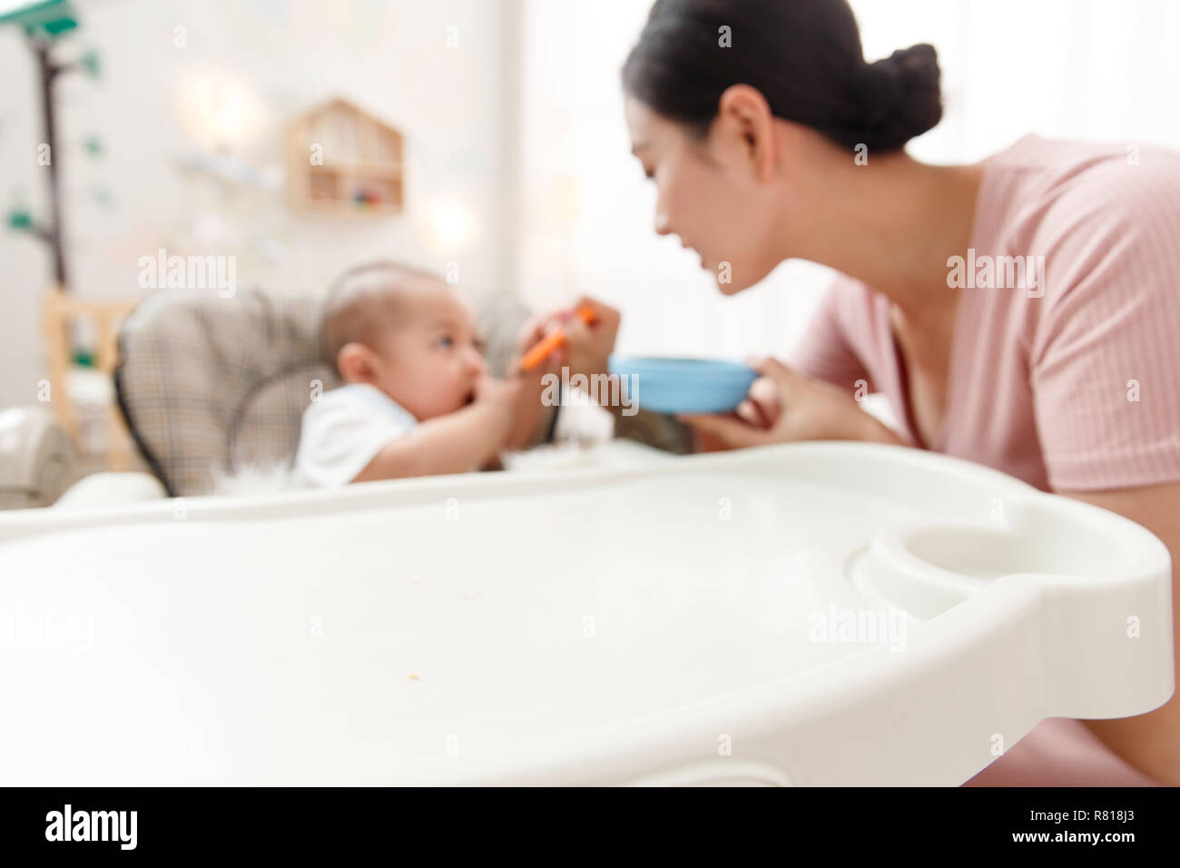 Mother to feed the baby Stock Photo