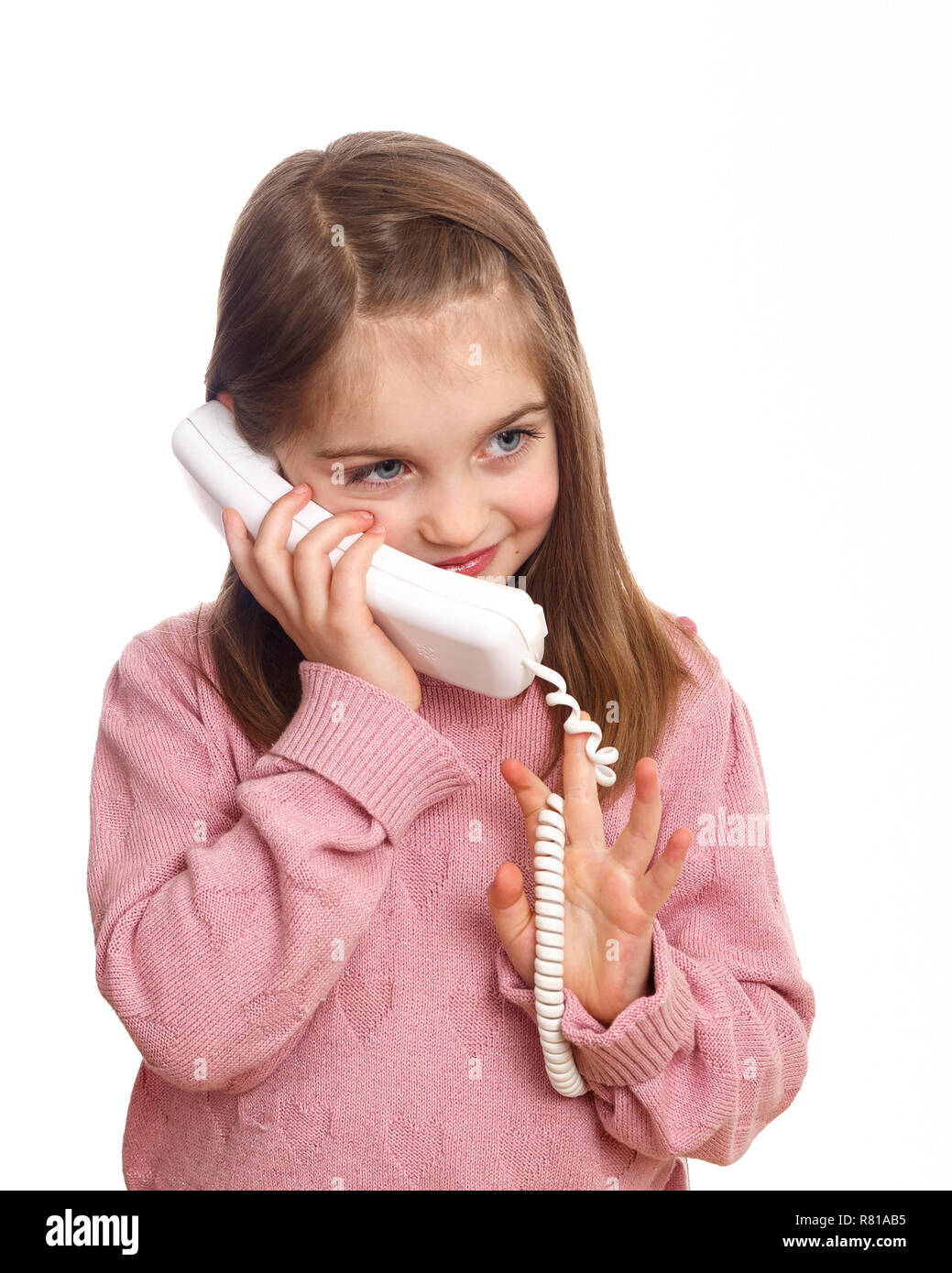 Happy cute caucasian young girl on the phone smiling isolated on white background Stock Photo