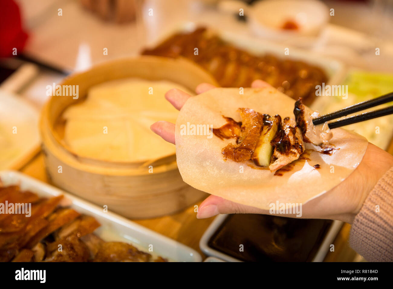 Young people eat roast duck Stock Photo - Alamy