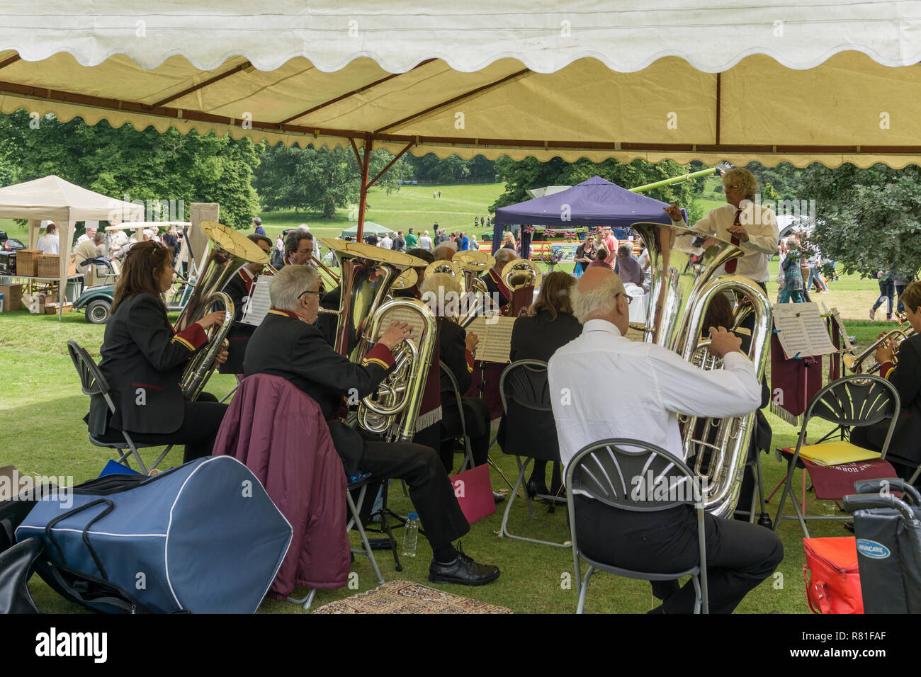 Traditional brass band, playing under canvas, at a village fete; Courteenhall, Northamptonshire, UK Stock Photo