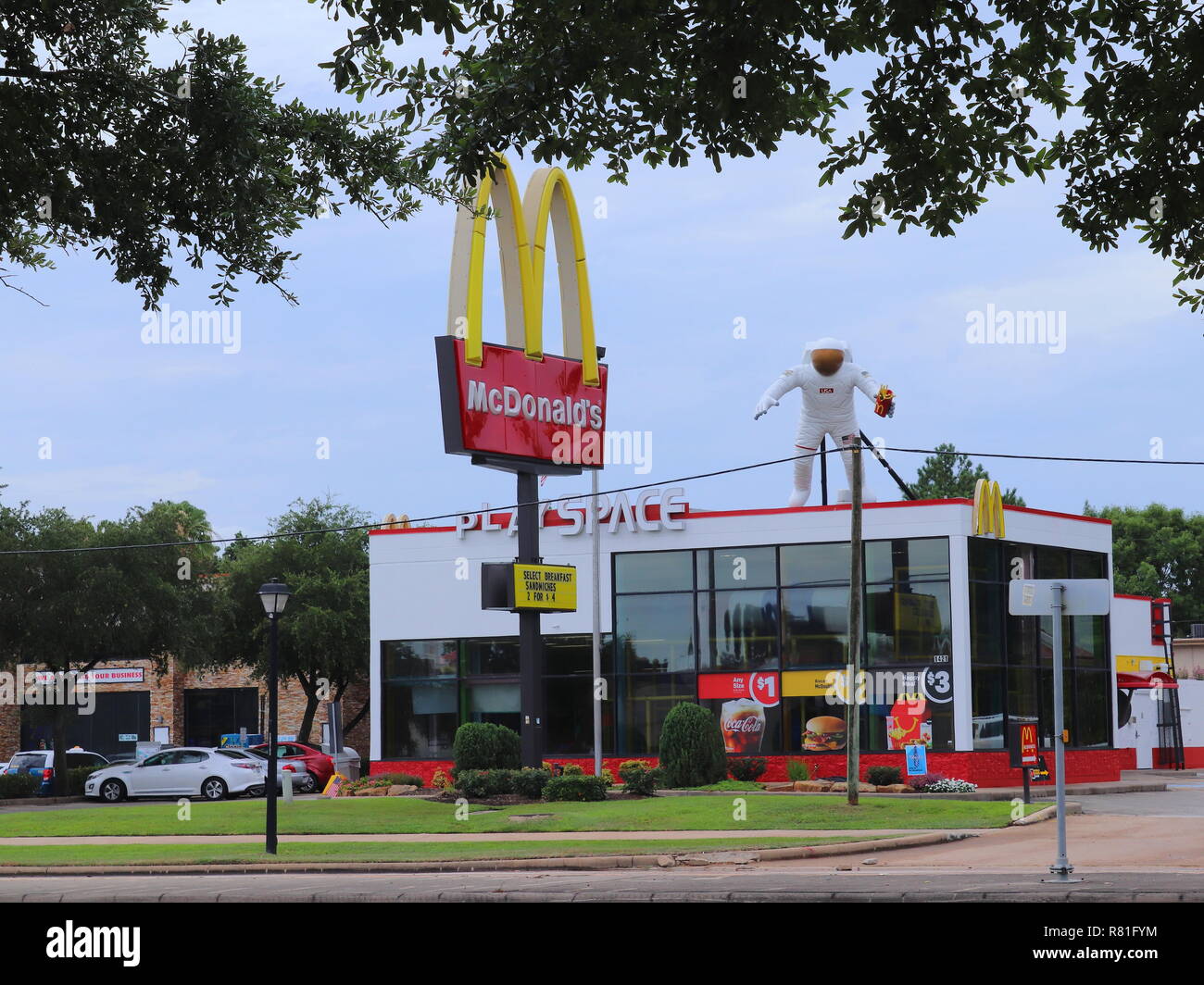 HOUSTON, TEXAS, USA - JUNE 9, 2018: NASA themed McDonald's restaurant in Houston, Texas. A giant astronaut with French fries on rooftop. Stock Photo